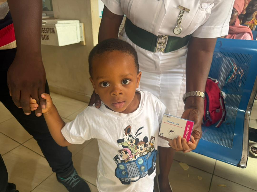 Child with SALMAL 120 anti-malarial medicine