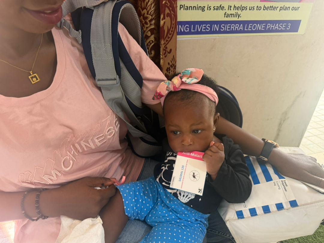 Mother and baby with SALMAL 120 anti-malarial